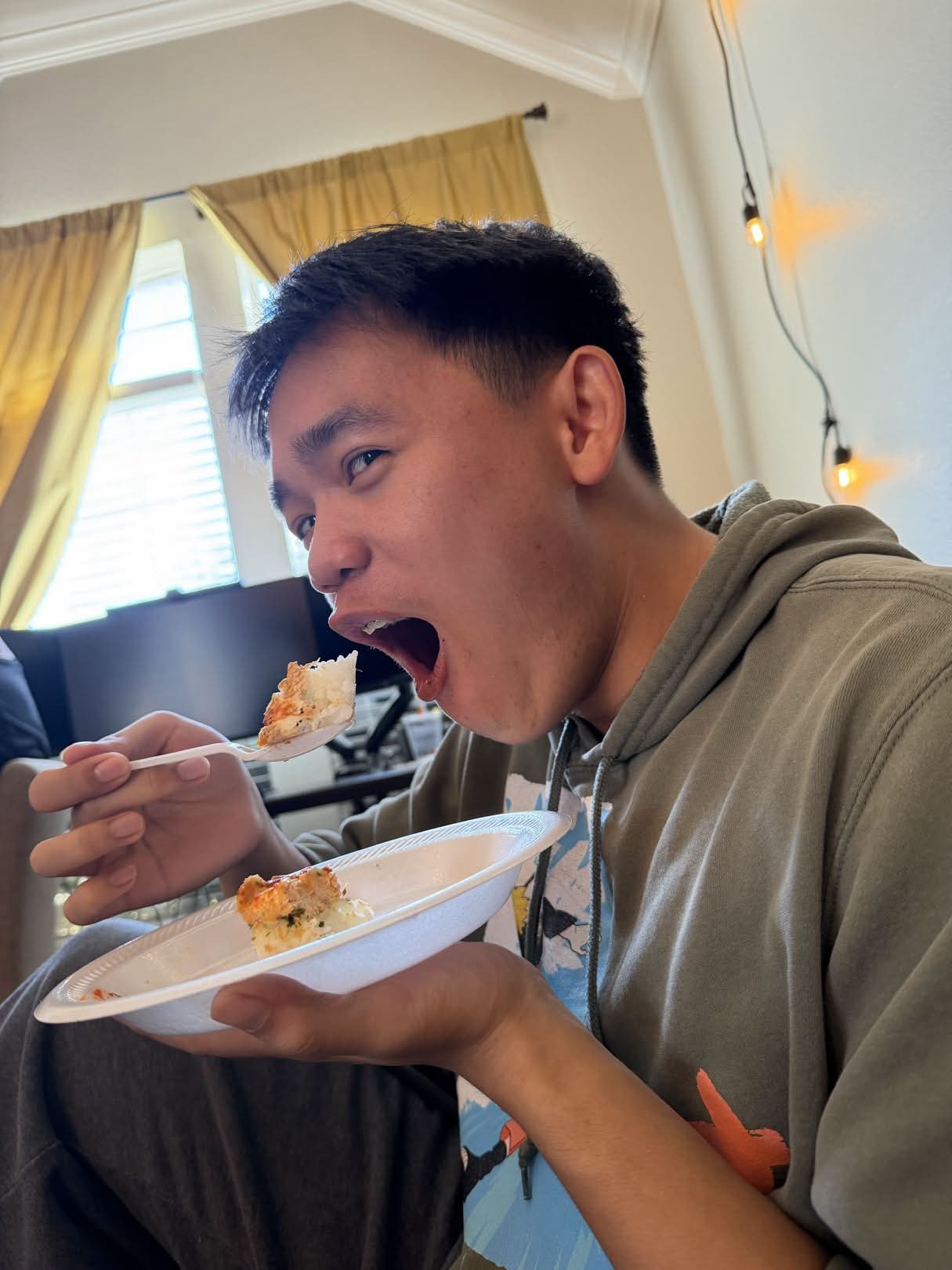 Wilson's cool thing he wanted to showcase! He's eating a mouthful of sushi.